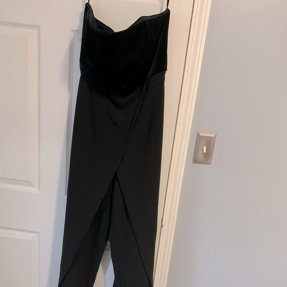 HOT and very elegant black believer up top jump suite with asymmetrical bottom!